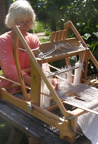 Fiona threading up an Ashford table loom
